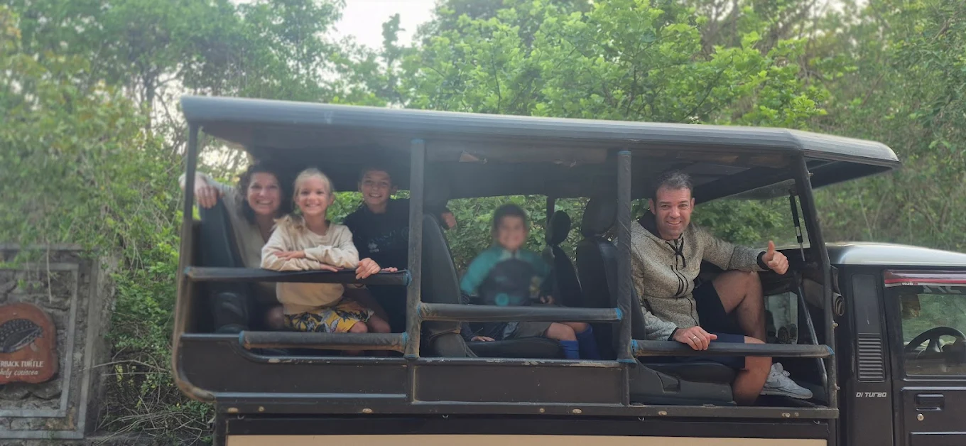 Family of tourists enjoying a safari jeep ride