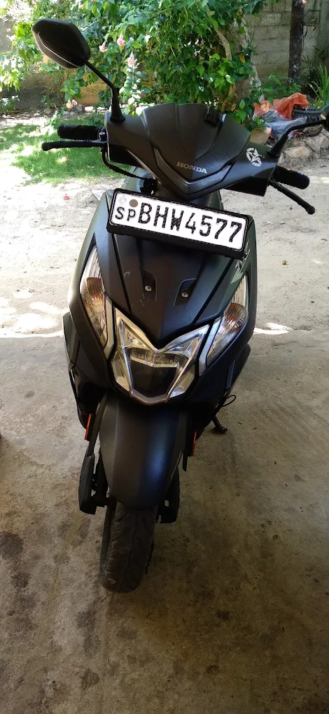 Black Honda Dio scooter - sleek matte finish